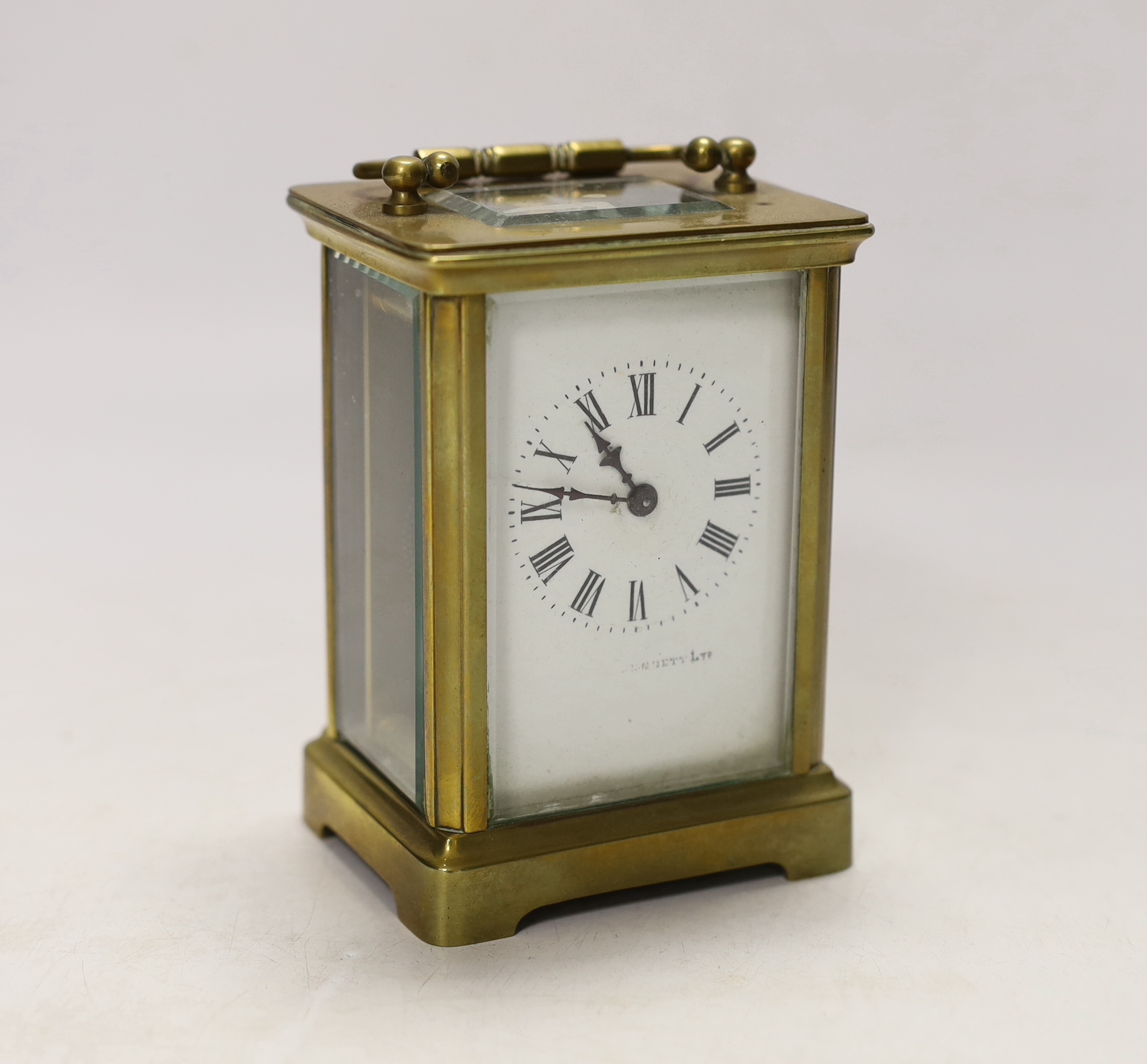 An early 20th century French lacquered brass carriage clock, cased